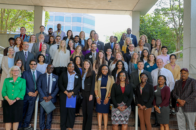 Graduate students and graduate school administrators pose on the Legislative Office Building steps in downtown Raleigh, NC during Graduate Education Day at the N.C. General Assembly.